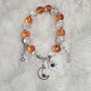 Orange and Clear Beaded Bracelet with Charms